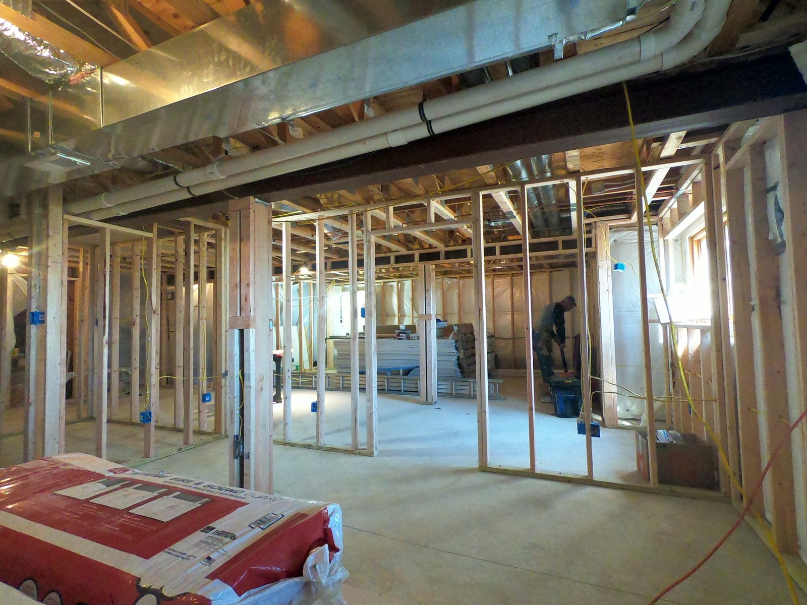 Basement under construction with new framing and insulation